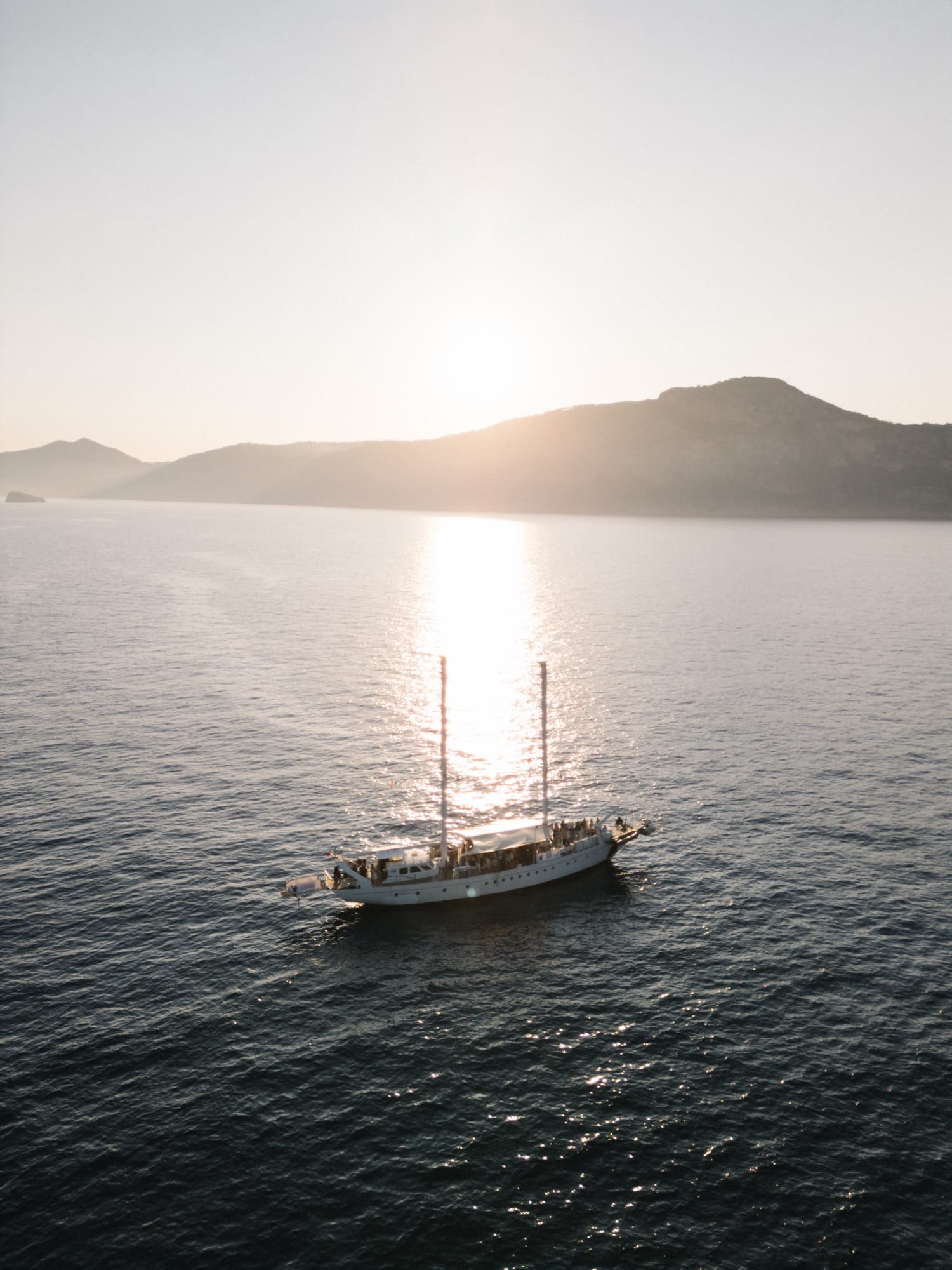 A sailboat at sunset